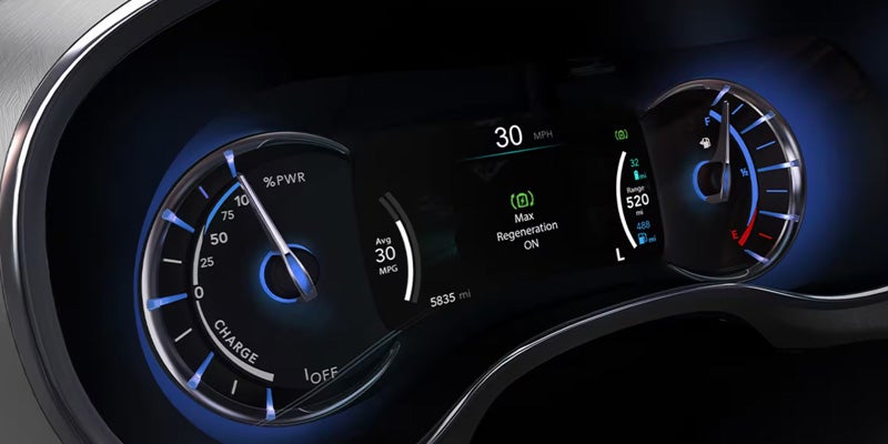 A digital car dashboard showing 30 mph, max regeneration on, 520 miles range, and a quarter tank of gas