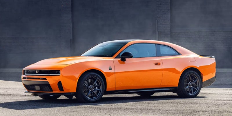A vibrant orange Dodge Charger Daytona
